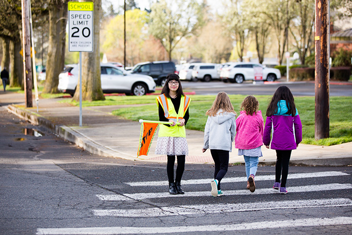 Elementary school patrol kids guarding the corners for safety. St